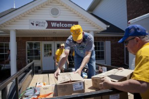 On Monday, May 5, volunteers with the Baptist General Convention of Oklahoma's Disaster Relief operation unload supplies for the hundreds of meals they will prepare for first responders and others who are serving in the Guthrie area. From left, volunteers are Brad Biddy, Larry Fordyce and Bill White. (Photo: Jonathan Burkhart)