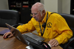 Stan Bradley, Bridge Creek, checks his list as he works to call out assessors after the March 25 tornadoes that hit Moore and Sand Springs (Photo: Bob Nigh)