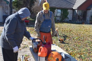 Oklahoma Baptist Disaster Relief volunteers refuel some chainsaws to continue cutting fallen tree limbs. (Photo: Chris Doyle)