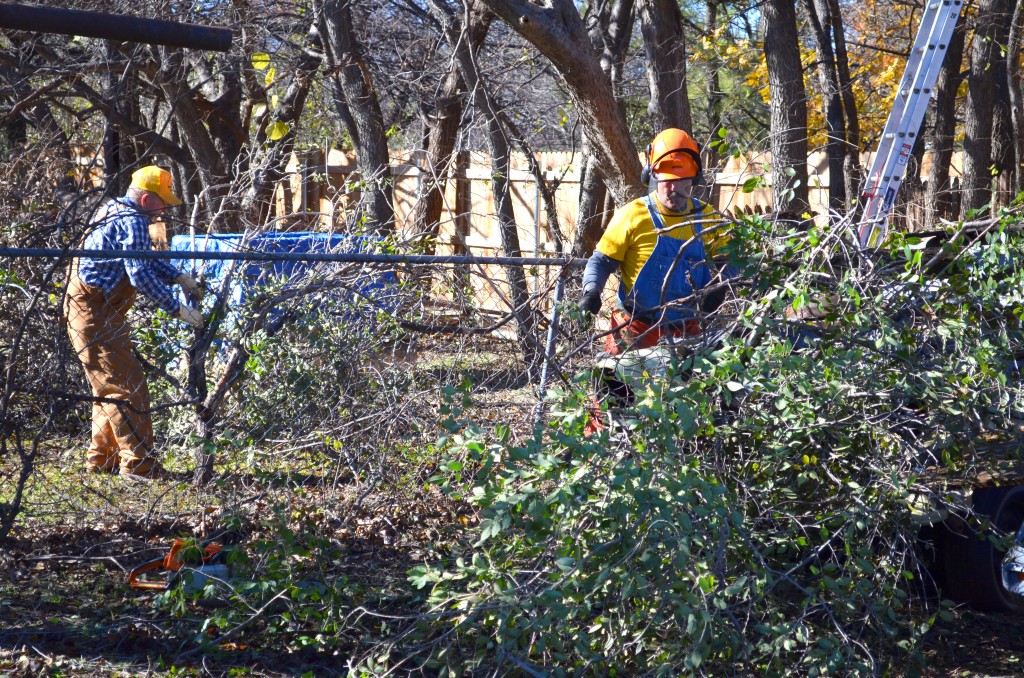 Disaster Relief volunteers work on multiple yards that were affected by the recent ice storm. (Photo: Chris Doyle)